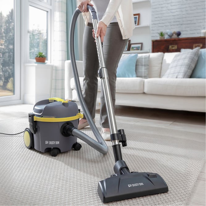 Image of vacuum cleaner on white rug